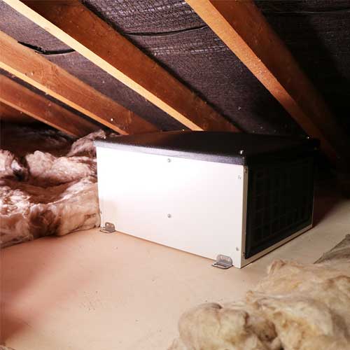 Elta PIV ONE Loft Mounted Positive Input Ventilation Unit installed in attic space, showcasing ventilation system components and setup.