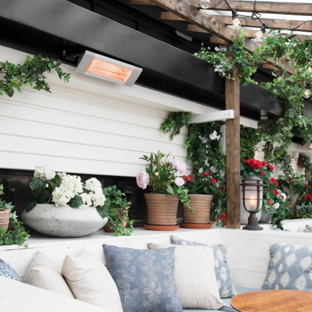 Systemair Frico IHC12 infrared radiant heater emitting warm light, designed for outdoor patios and heating spaces efficiently.
