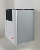 Zehnder ComfoAir Q350 heat recovery unit with vent ducts and control panel, designed for efficient indoor air ventilation.